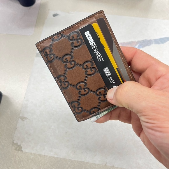Like NEW and authentic Gucci Brown GG Embossed Leather Card Holder. Beautiful!